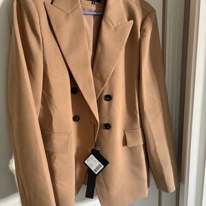 Tan Blazer. Perfect for spring wear on cool evenings.  Two deep pockets